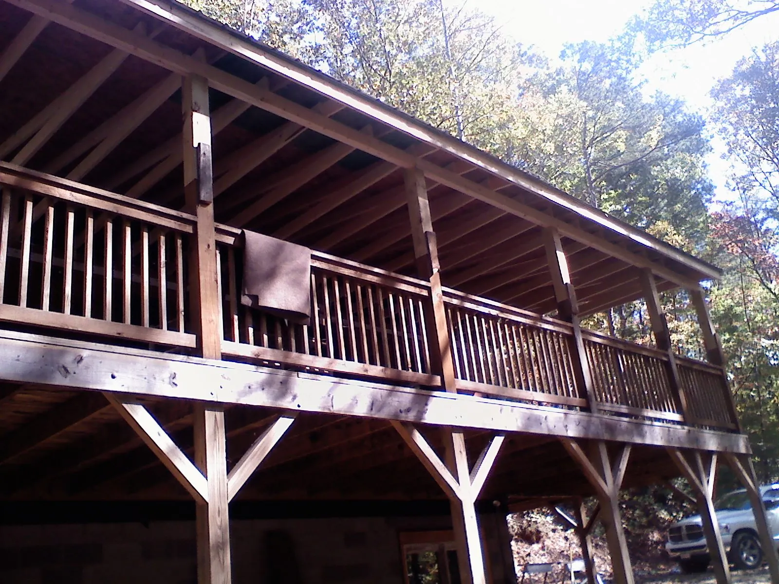 Timber framing under a new elevated porch and deck — Roof Leak Repair in Missoula by Roofing Brothers